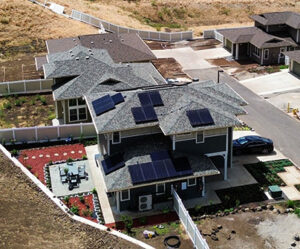Aerial view of 2 Story home with solar panels on roof