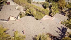 Aerial view of a completed residential roof installation by Suncovia, providing high-quality and durable roofing solutions for homes.