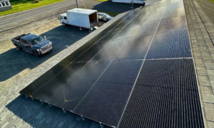 Large rooftop solar panel installation by Suncovia, providing efficient and renewable energy for sustainable living.