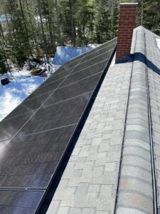 Snow-covered property with Suncovia-installed rooftop solar panels, providing efficient energy solutions even in winter conditions.