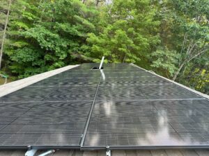 Suncovia solar panel installation on a residential roof, optimizing renewable energy efficiency with sleek black panels.