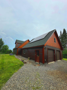 Custom solar panel installation by Suncovia on a rustic residential home, providing renewable energy for sustainable living.