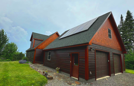Custom solar panel installation by Suncovia on a rustic residential home, providing renewable energy for sustainable living.