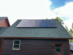 Suncovia solar panel installation on a dark brown home with a shingled roof, optimizing energy efficiency and sustainability.