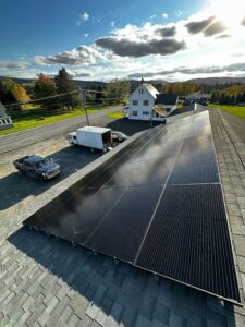Solar panel installation on a residential rooftop by Suncovia, harnessing sustainable energy under a sunny sky for efficient power generation.