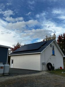 Efficient rooftop solar panels installed by Suncovia on a modern garage, delivering clean and renewable energy for sustainable living.