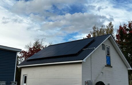 Efficient rooftop solar panels installed by Suncovia on a modern garage, delivering clean and renewable energy for sustainable living.