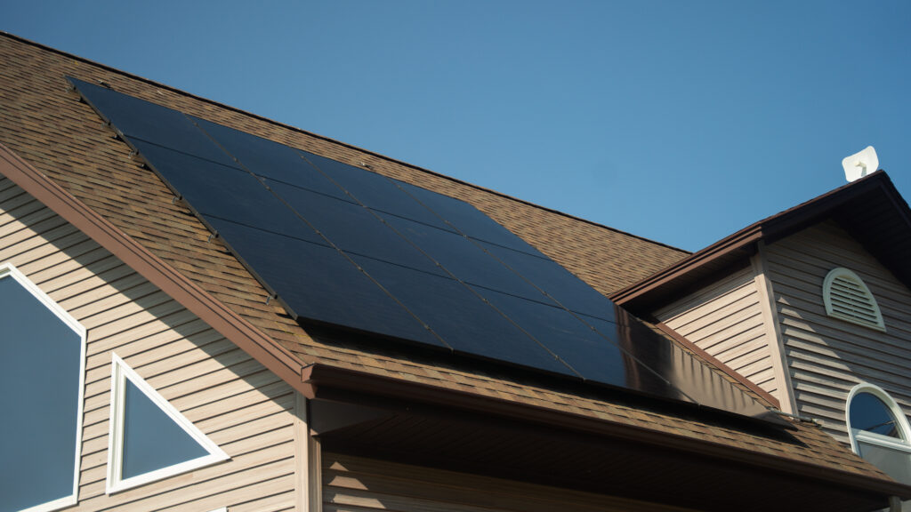 Residential Home with Energy-Efficient Rooftop Solar Panels by Suncovia