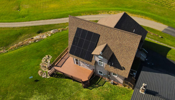 Modern New England home with solar panels installed by Suncovia, showing how solar panels increase home value while generating clean energy