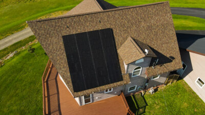 Completed full-service solar installation in New England by Suncovia, showing installed solar panels on a residential roof