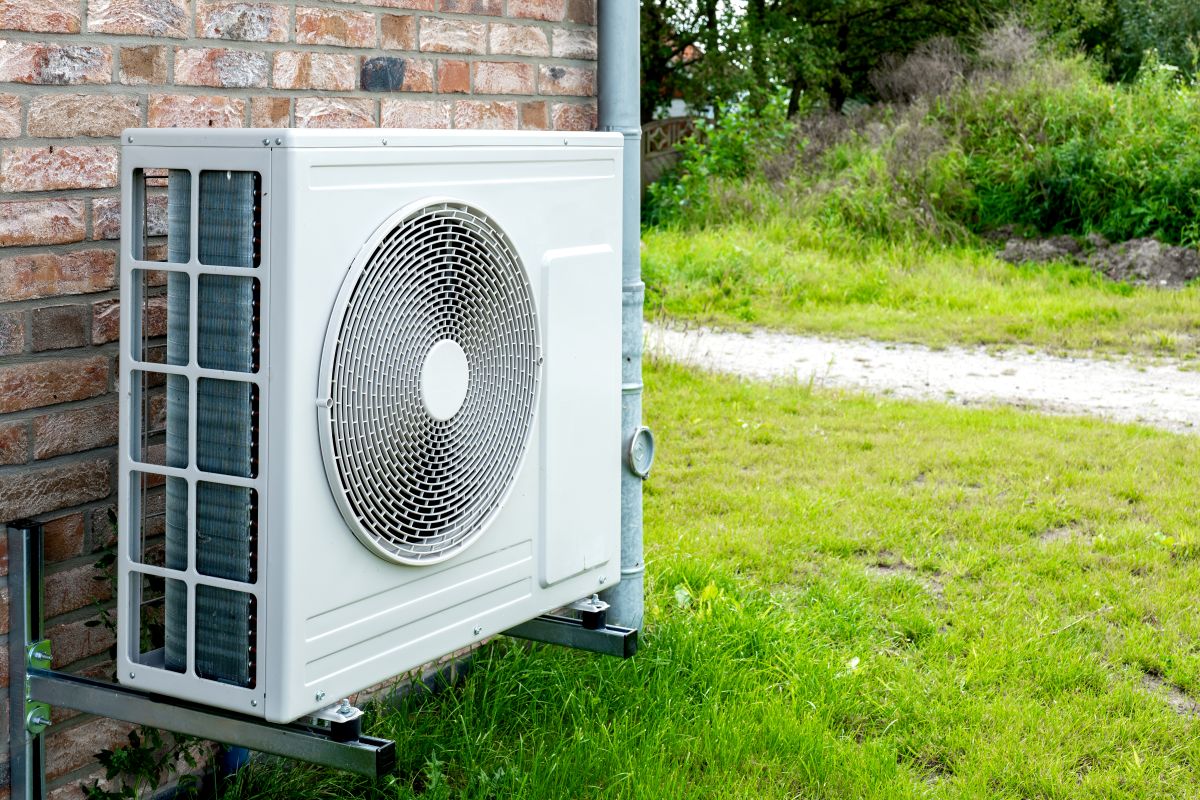 heat pump blowing cold air white unit outside