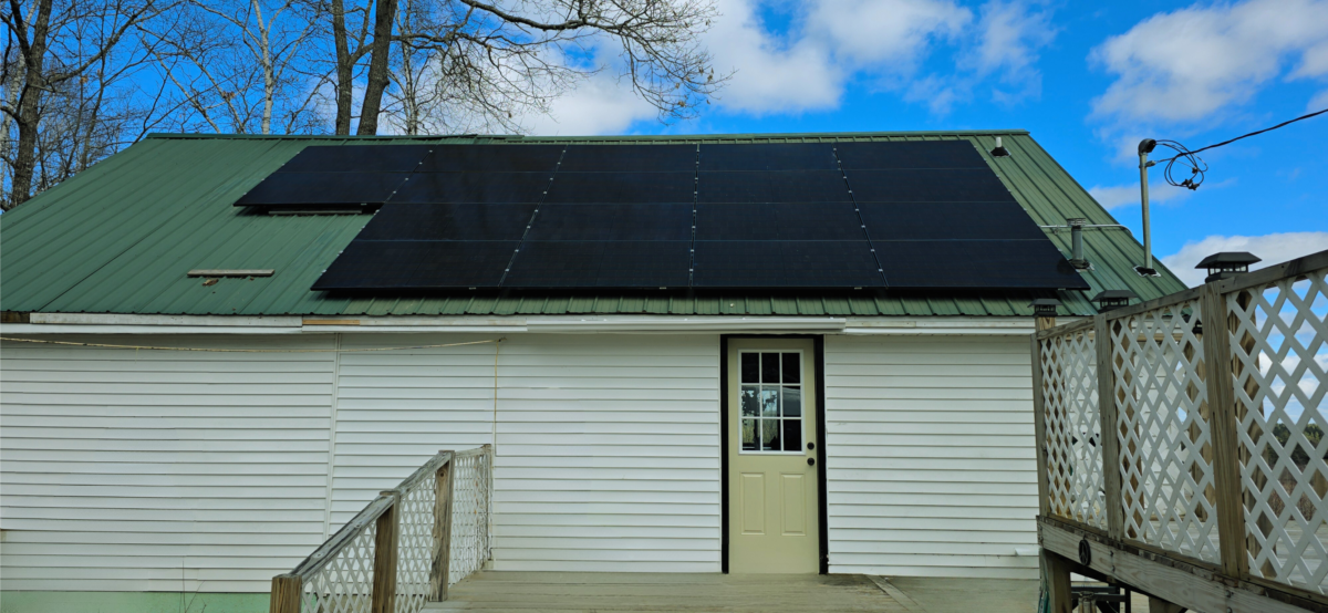 small house white siding house blue sky