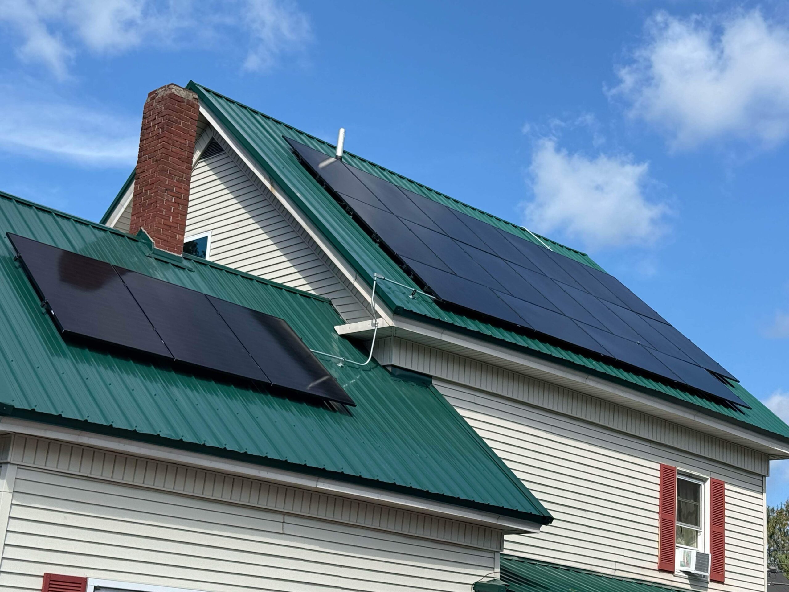 green metallic roof beige cream siding